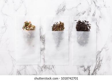 Herbal, Black, Green Tea In A Sachet On A Marble Surface