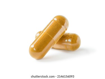 Herbal capsules, herb turmeric capsules on white background.Curcumin Herbal medicine extract from nature. - Shutterstock ID 2146156093