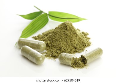 Herbal Capsules And Powder On White