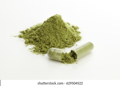 Herbal Capsules And Powder On White