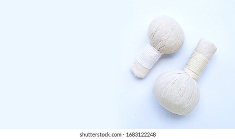 Herbal compress balls for Thai massage and spa treatment  on blue background.  Copy space