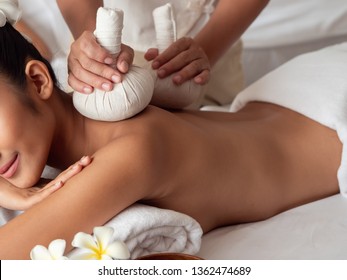 Herbal Compresses In A Spa. Thai Massage For Health.