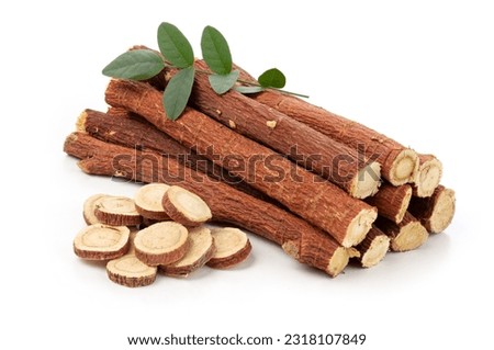 herbal medicine licorice root sticks and slices with leaf isolated on white background. Imagine de stoc © 