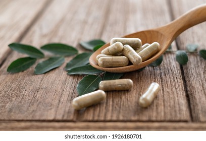 Herbal Medicine Tablets Are Placed In A Wooden Spoon, Nutritional Supplement, Vitamin Pill, Herbal Medicine.