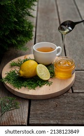 Herbal Natural Tea With Honey And Lemon On Wooden Desk. Fresh Antioxidant Beverage 