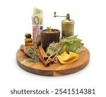 Herbal ritual candle in clay pot between natural ingredients: beeswax, cinnamon, bay leaf and dried wild plants on round board isolated on white. White magic to attract money.