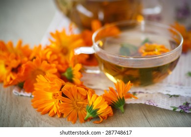 Herbal Tea With Marigold Flowers On The Table