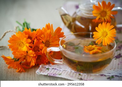 Herbal Tea With Marigold Flowers On The Table