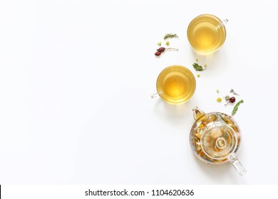 Herbal tea of mint, chamomile, rose hip and other herbs on white background. The view from the top. Copy space