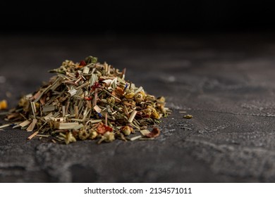 Herbal tea on a dark marble background. tea concept. top view.Copy space.Relaxing herbal tea. - Shutterstock ID 2134571011