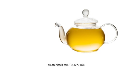 herbal tea served in a transparent glass teapot isolated over white backgound ready for breakfast or tea ceremony. High quality photo