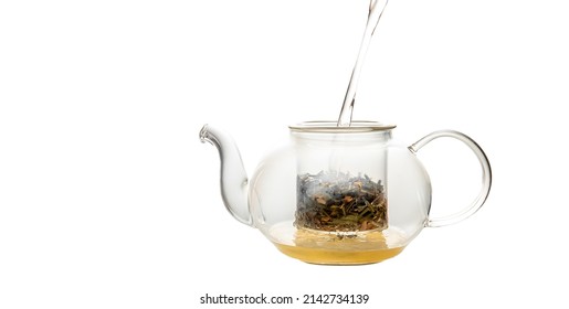 Herbal Tea Served In A Transparent Glass Teapot Isolated Over White Backgound Ready For Breakfast Or Tea Ceremony. High Quality Photo