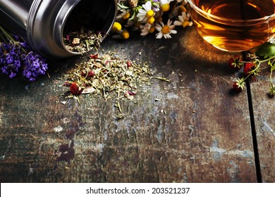 Herbal Tea And Wild Organic Flowers On Wooden Background