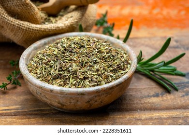 Herbes de Provence, mixture of dried herbs typical of the Provence region, blends often contain savory, marjoram, rosemary, thyme, oregano, lavender leaves, used with grilled food and stew - Shutterstock ID 2228351611