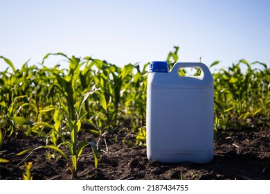 Herbicide Plastic Canister Can In Corn Field, Crop Protection Concept