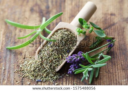 Herbs de Provence On A Wooden Background