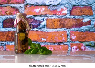 Herbs In A Decorative Bottle, Preserved Spices, Marinade, And Basil Leaves, Space For Text, Culinary Photography