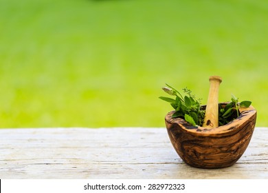 Herbs - Fresh herbs in a mortar