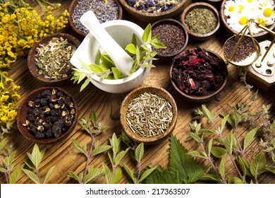 Herbs medicine and vintage wooden - Shutterstock ID 217363507