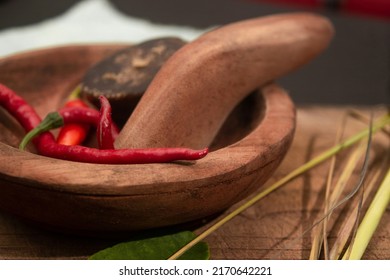 Herbs On Mortar And Pestle. Close Up Herbs .traditional Kitchen Photo Concept