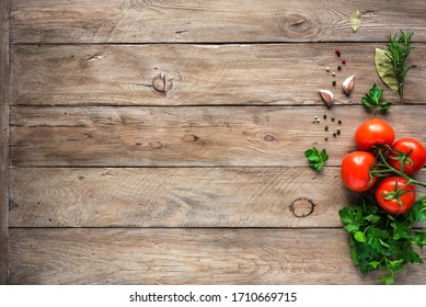 Herbs and spices with fresh tomatoes on wooden background. Cooking and healthy eating concept, top view, copy spce. - Powered by Shutterstock