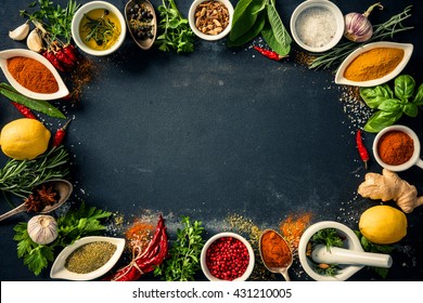 Herbs and spices over black stone background. Top view with copy space - Powered by Shutterstock