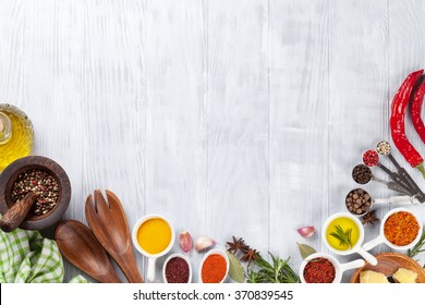 Herbs and spices over wood background. Top view with copy space