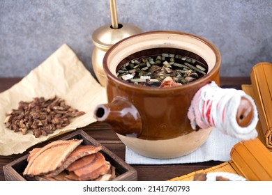 Herbs waiting for decoction in medicine pot - Shutterstock ID 2141760793
