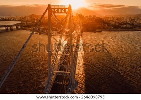 Hercilio luz cable stayed bridge with sunset sky in Florianopolis, Brazil. Above view