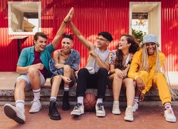 Here's To Friendship. Group Of Multiethnic Young People Enjoying Hanging Out Together Outdoors In The City. Cheerful Generation Z Friends Having Fun And Making Happy Memories.