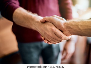Heres to a successful project. Closeup of two unrecognizable peoples hands greeting and shaking hands inside of a office at work. - Shutterstock ID 2167788137