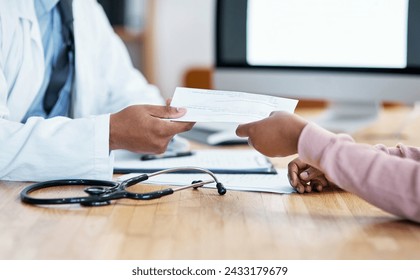 Heres your sick note for work. Closeup shot of an unrecognisable doctor giving paperwork to a patient during a consultation.