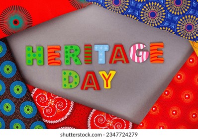 Heritage Day South Africa, 24th September. Heritage Day written in colorful letters with iconic South African printed cloth