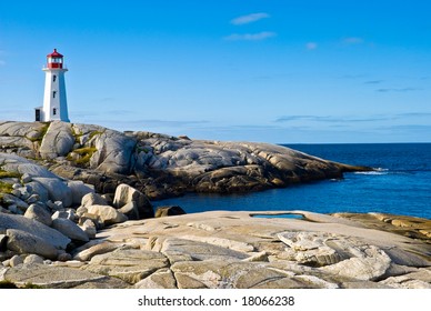 Heritage lighthouse on a rocky beach. Peggy's Cove, Canada. - Powered by Shutterstock