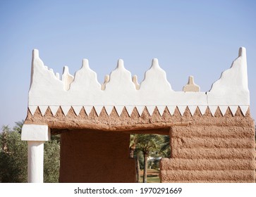 A Heritage Old Building - Ancient Traditional Mud Building With Palm Farm In The Background In Hail, Saudi Arabia