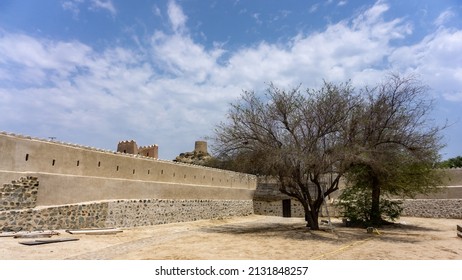 Heritage site on an Arabian peninsula with a view of an old city built in the rocky desert environment. Hot sunny day scenery of an old rural village. 