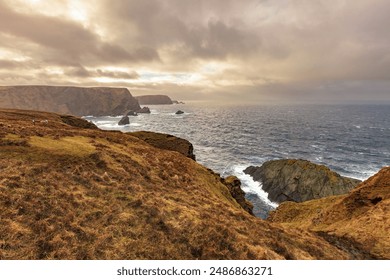 Hermaness National Nature Reserve, Unst Island, Shetland Islands, Scotland, cliffs, windy sea, rocky coast and grassland - Powered by Shutterstock