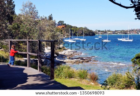 Hermitage foreshore track with a beautiful view on a bay with boats, Sydney, Australia