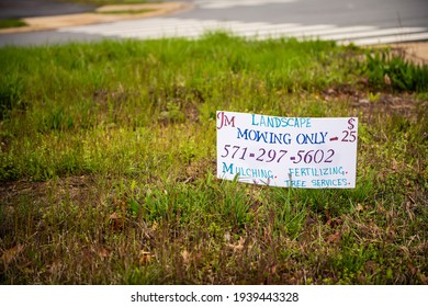 Herndon, USA - April 1, 2020: Sign From Local Small Landscaping Business Company Offering Mulching, Tree Cutting And Fertilizing, Mowing In Fairfax County With Phone Number