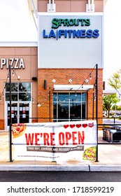 Herndon, USA - April 27, 2020: Strip Mall Plaza On Street In Virginia Fairfax County With Sign For Open Pizza Restaurant For Take-out Curbside And Delivery During Coronavirus Covid-19