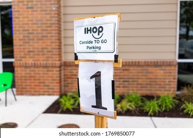 Herndon, USA - June 11, 2020: Virginia Fairfax County Closeup Of Parking Spot Sign For Open Ihop Restaurant For Take-out And Delivery During Coronavirus