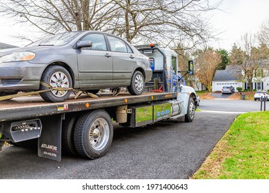 Herndon, USA - November 21, 2020: Car In Driveway With Tower Tow Vehicle Truck Due To Fuel Leak Trouble Damage Safety In Virginia Neighborhood Residential