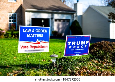 Herndon, USA - November 3, 2020: Northern Virginia Fairfax county with Trump Pence keep America Great, Law and Order Matters presidential election yard signs in suburbs