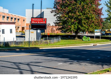 Herndon, USA - October 7, 2020: Fairfax county education system Herndon Public high school sign by street road in Northern Virginia