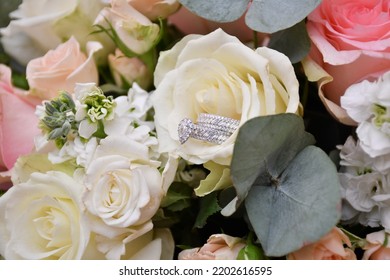 Hero Shot Of Engagement Ring With Flowers