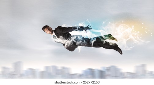 Hero Superman Flying Above City With Smoke Left Behind Concept