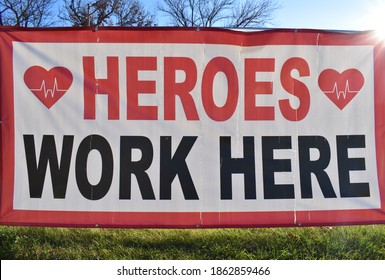 Heroes Work Here Sign In A Yard