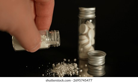 Heroin or crushed oxycodone placed in a container. Powdered illegal drugs stored in a glass vial, indicating substance abuse. Ongoing crisis involving opioids and fentanyl. 
