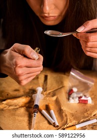 Heroin Withdrawal Help . Woman Addict Use Heroin Narcotic . Junkie With Spoon Cooking Drug. Sossial Issues And Portrait Close Up.