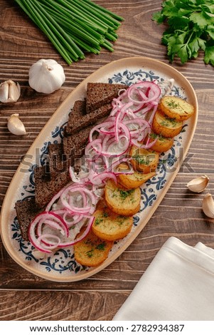 Herring appetizer with potatoes and rye bread
